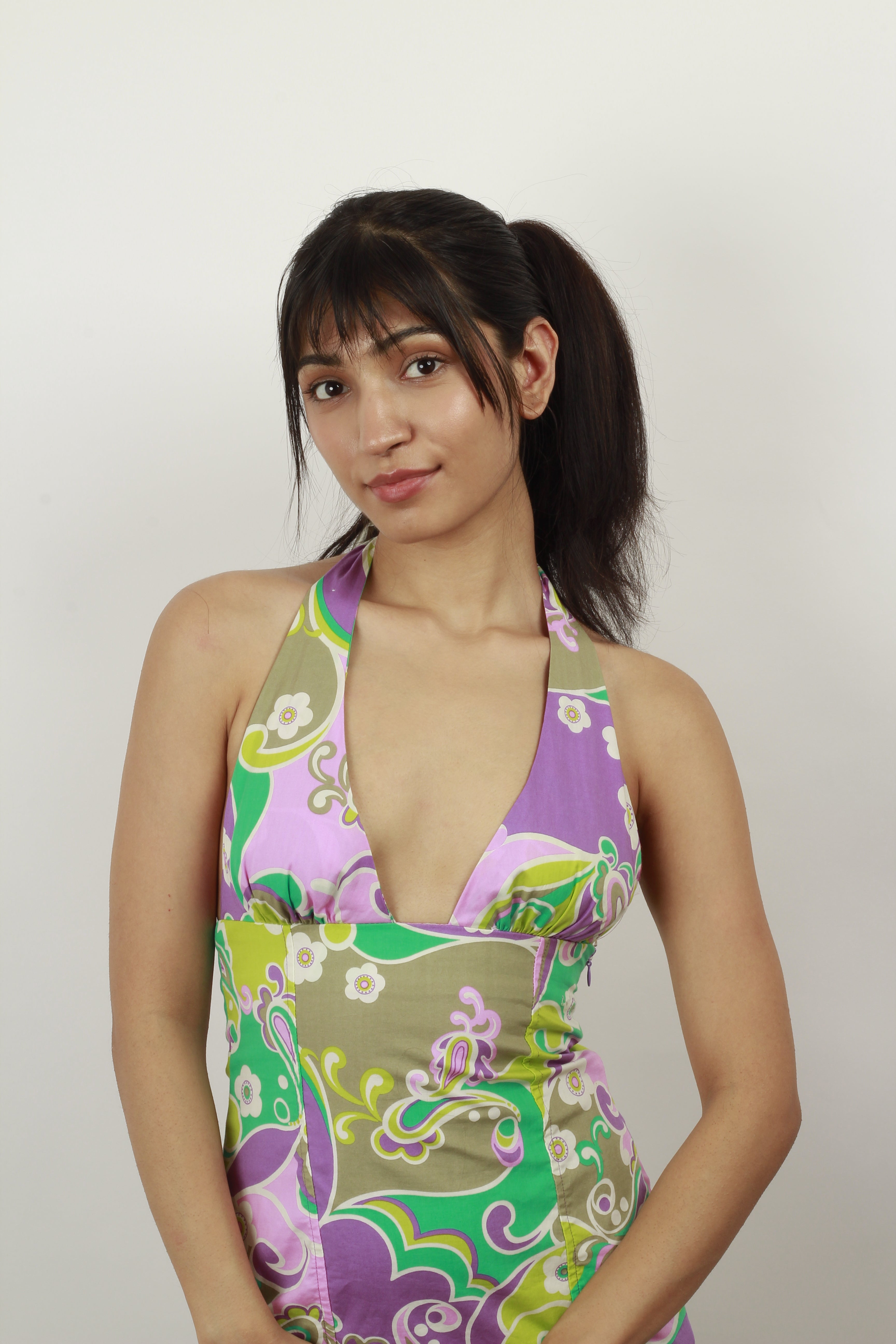 Model Wearing Dolcy Top Knot Straight Hair Extension in Jet Black – Front View Showing Voluminous Sleek Bun Shape, Fringe, and Seamless Blend with Natural Hair