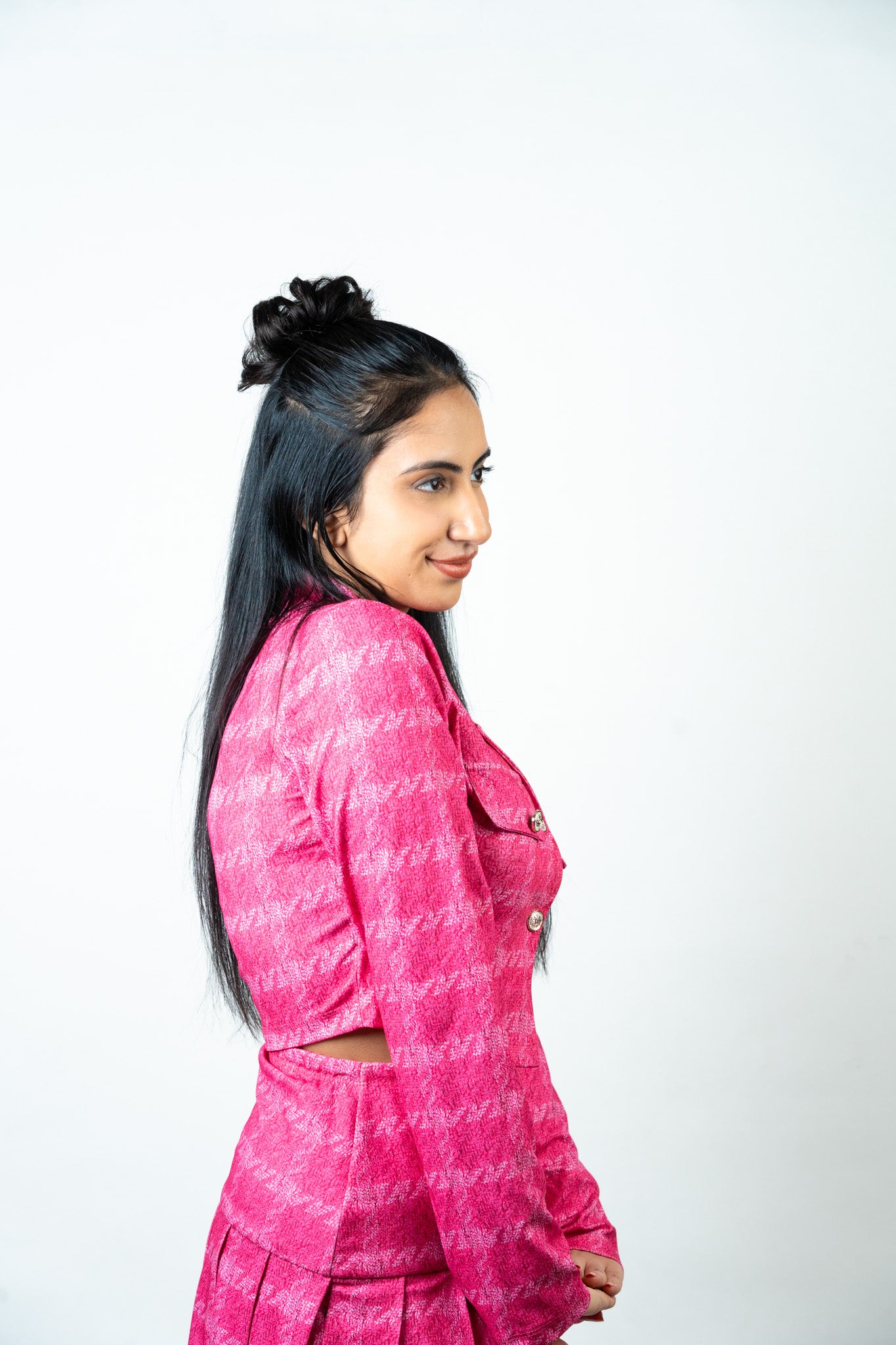 Rear Angled Side View of Model Wearing Dolcy Messy Hair Bun in Jet Black – Half-Up Bun Style with Long Straight Hair, Natural Effortless Look