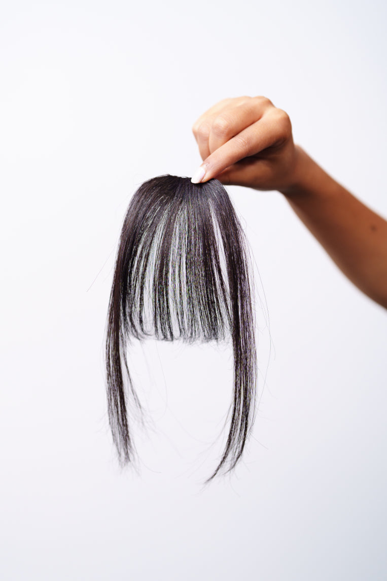 Styled Korean fringe clip-in bangs by Dolcy - soft curtain bang look, available in natural black, jet black, and dark brown